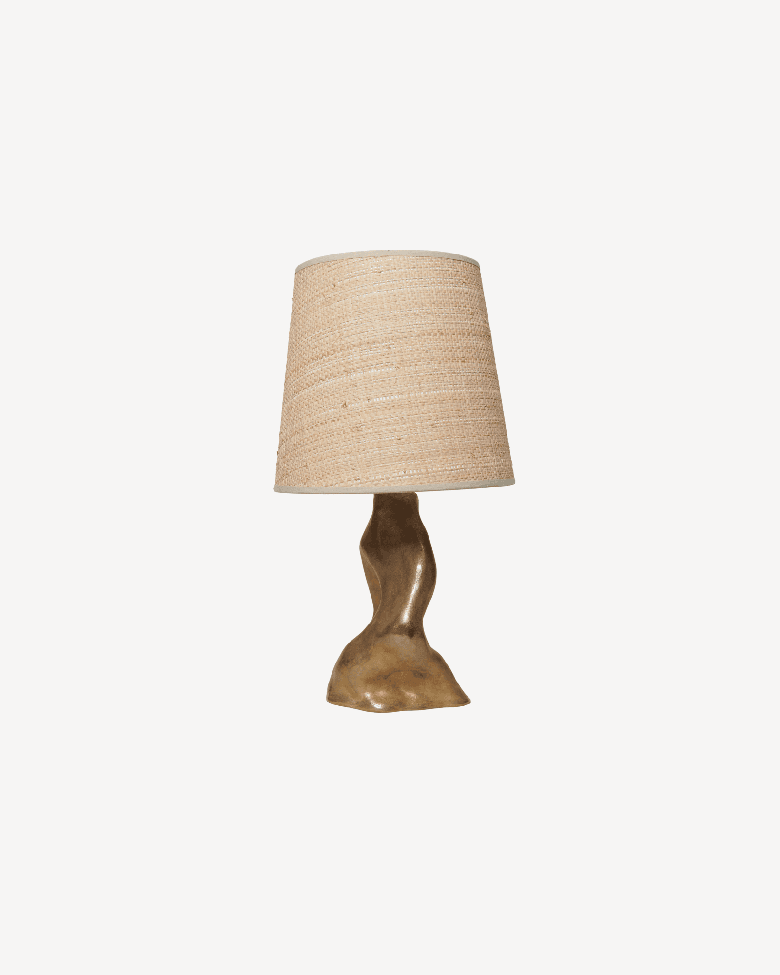 Tara table lamp by Karouna Chanyudhakorn, woven raffia shade and sculpted solid bronze base
