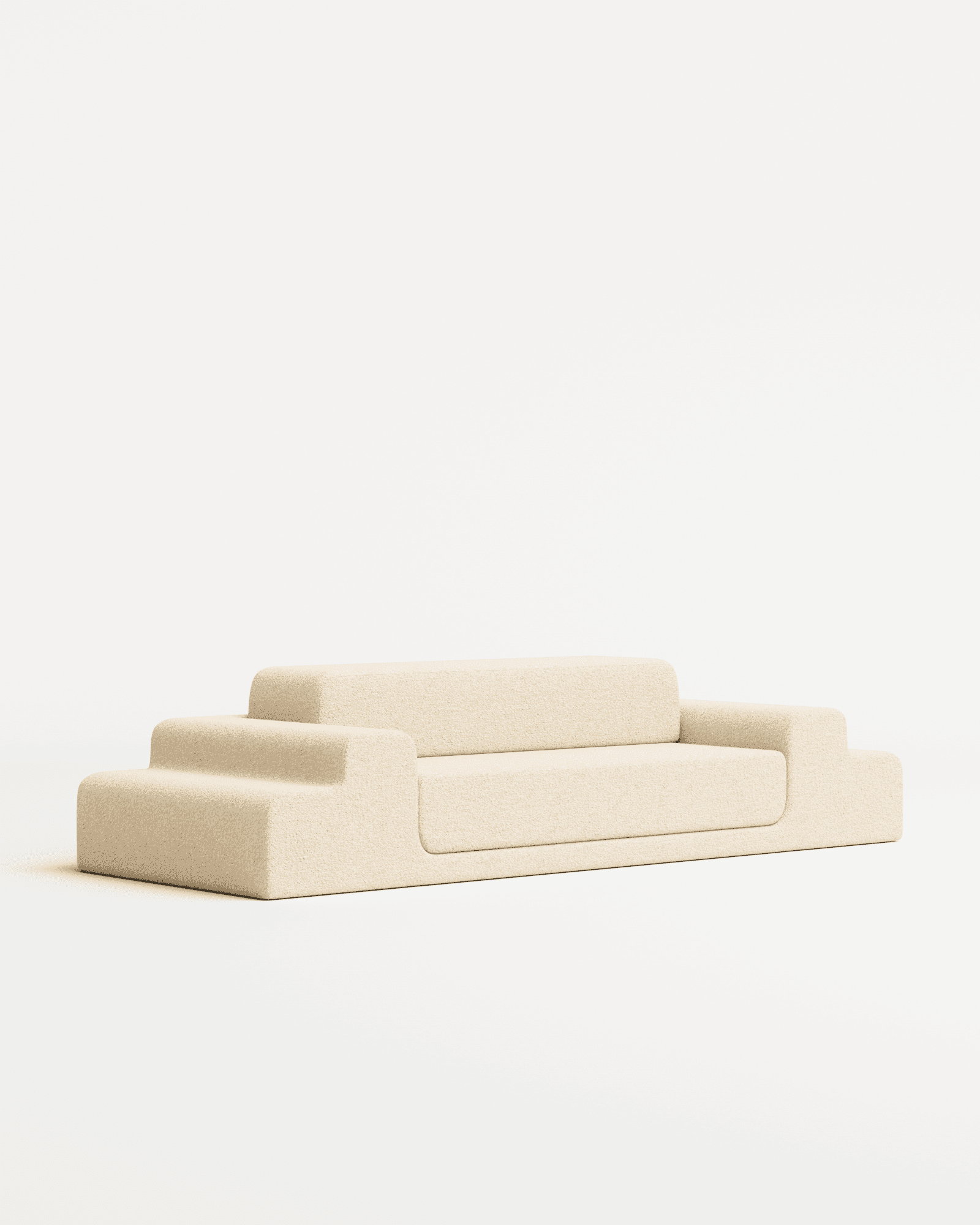 Médano sofa in bouclé by Estudio Persona, low-profile modular seating with stepped sections in light beige textured fabric
