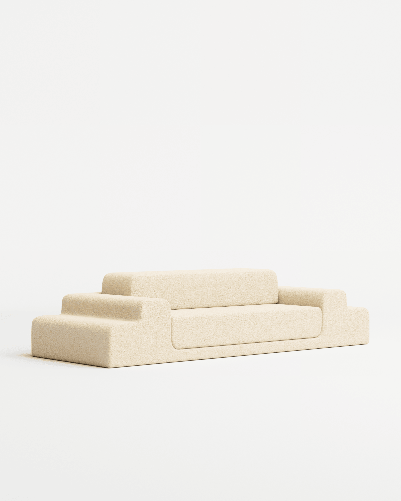 Médano sofa in bouclé by Estudio Persona, low-profile modular seating with stepped sections in light beige textured fabric
