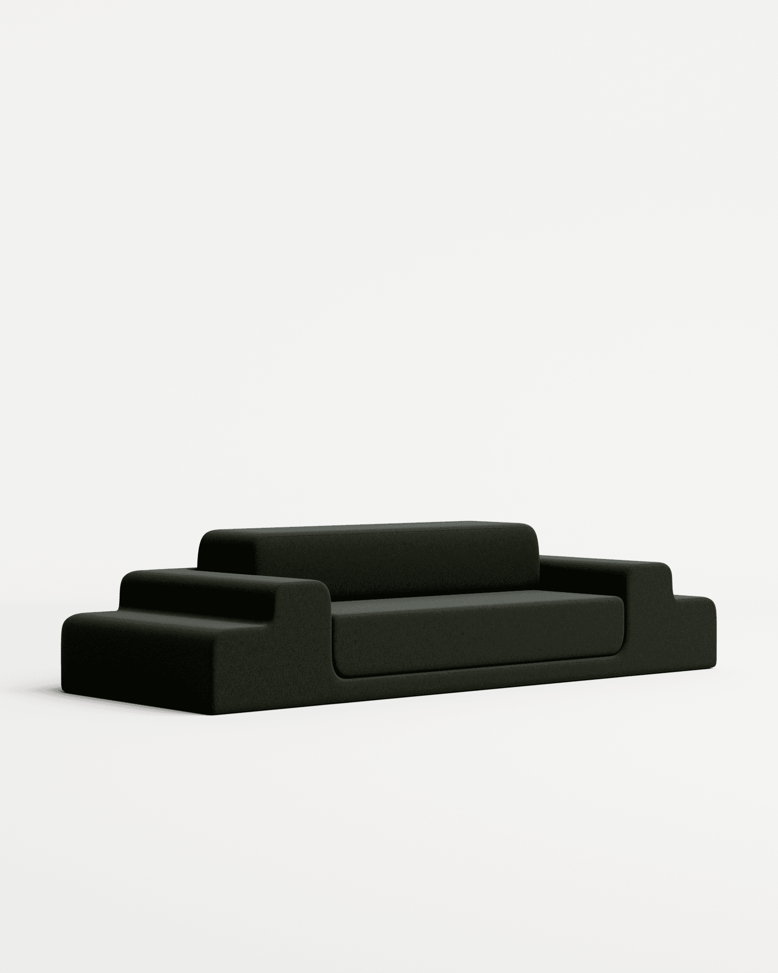 Médano sofa in velvet by Estudio Persona, elongated modular sofa with stepped rounded sections in dark charcoal velvet