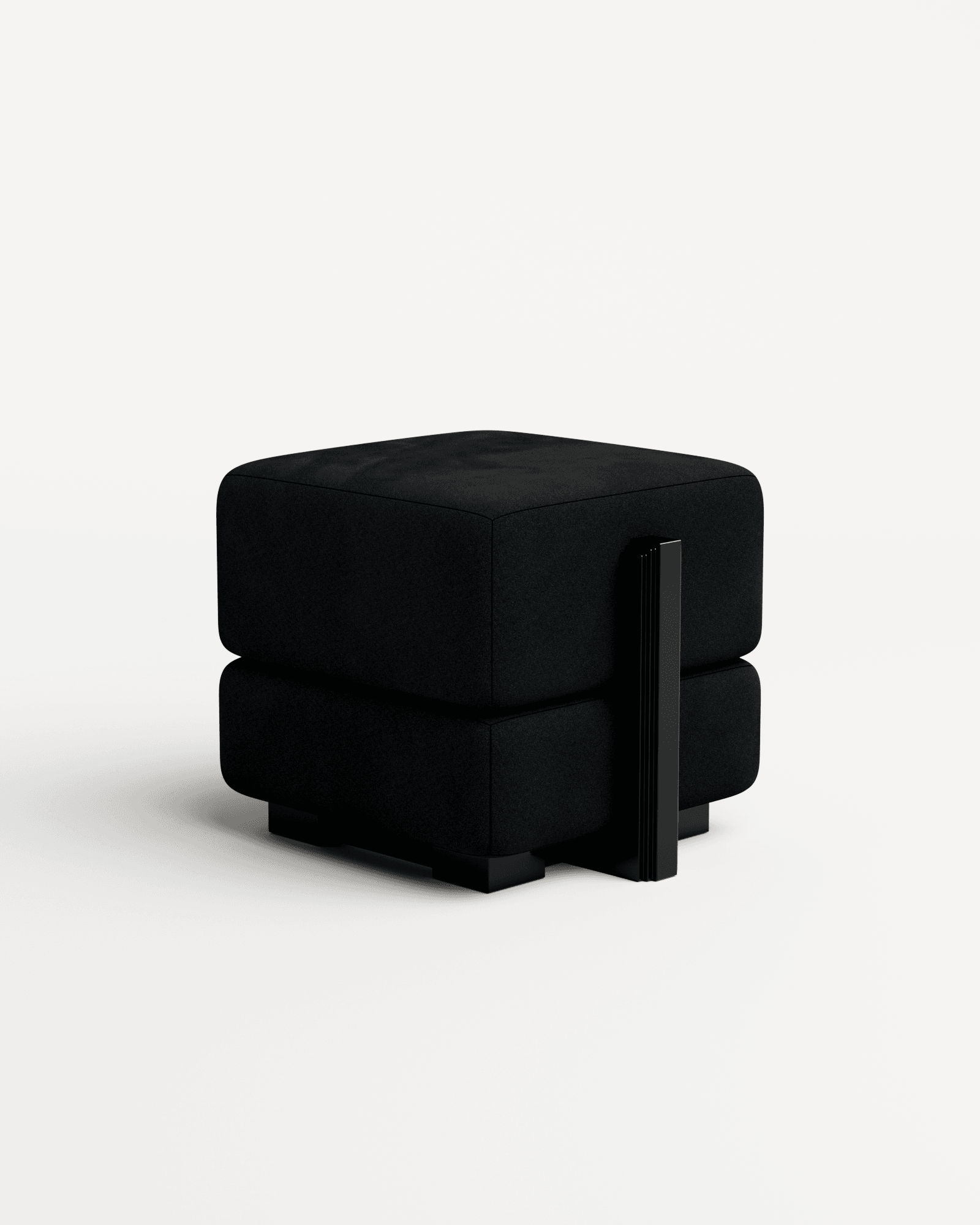 Rodez Ottoman by Thomas Moisan – stacked black velvet cushions with ribbed metal vertical accent