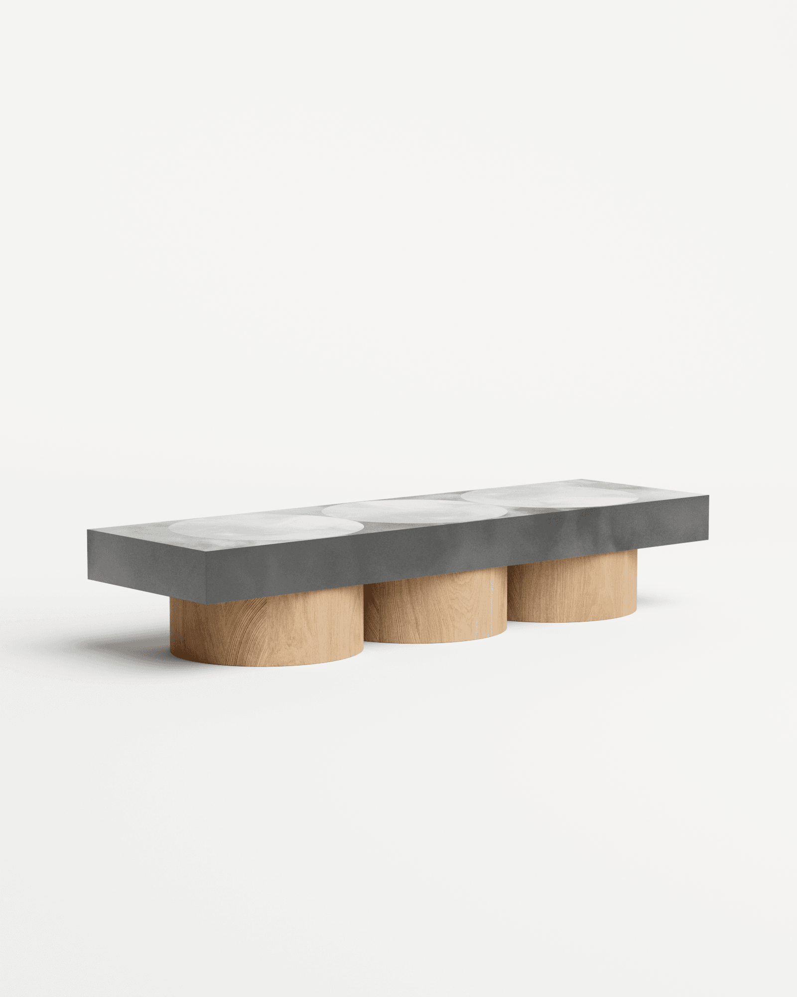 Slab M coffee table by Benni Allan – dark concrete-effect slab with three circular inlays on three cylindrical oak pedestals