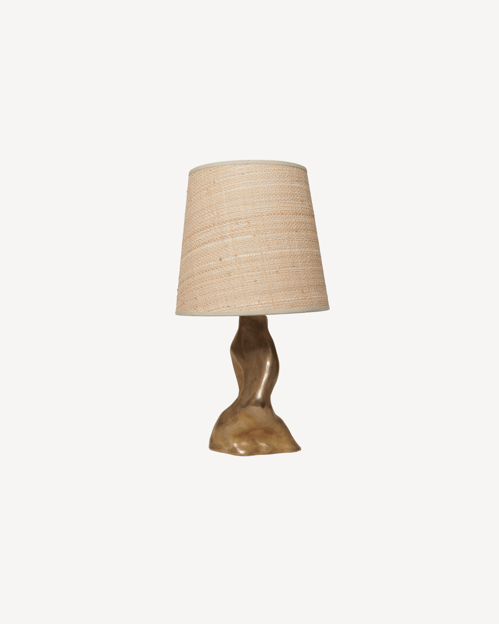 Tara table lamp by Karouna Chanyudhakorn, woven raffia shade and sculpted solid bronze base