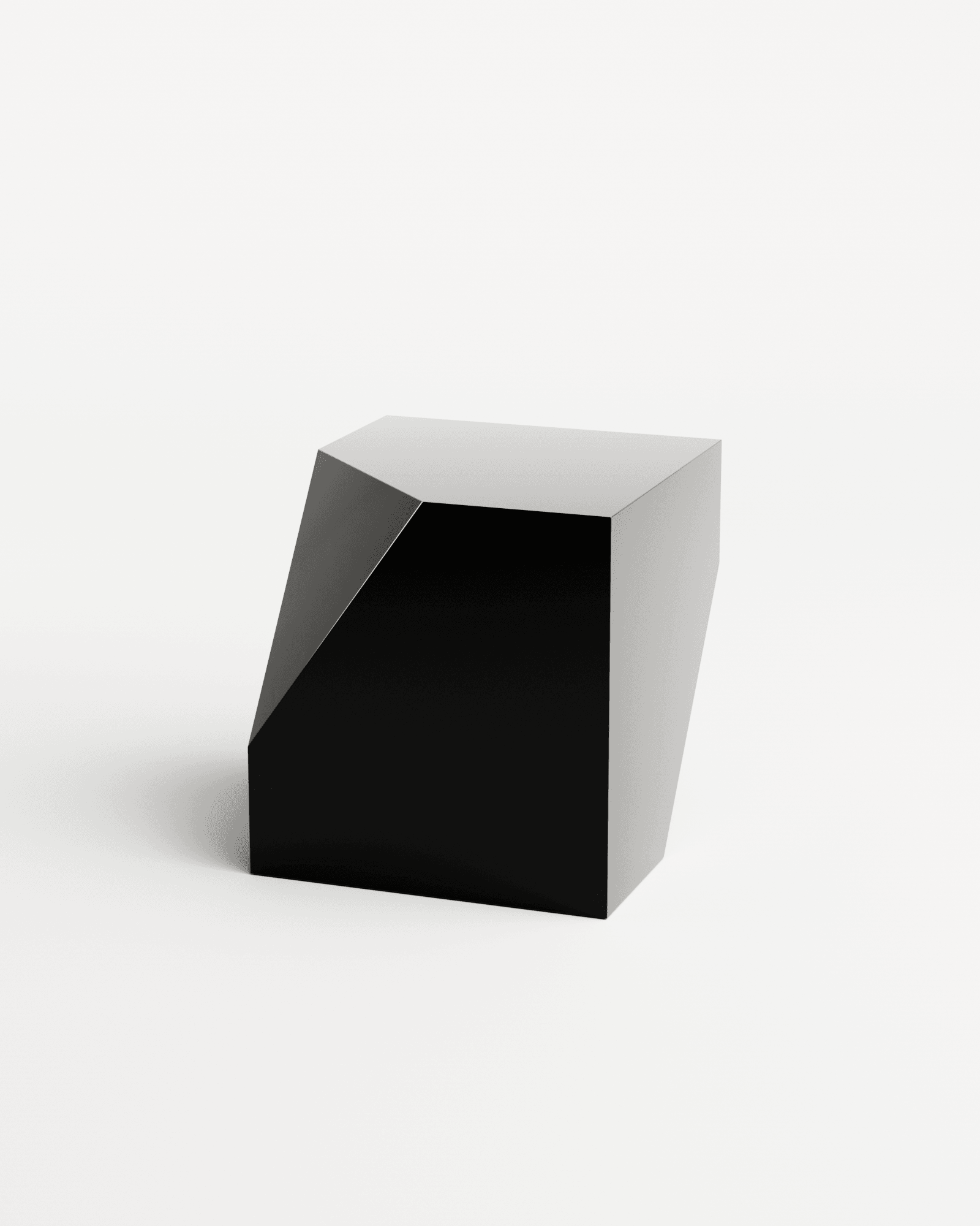 Bevel Side Table chrome mirror black by HADGE - sculptural high-gloss black faceted steel block with sharp angular geometry
