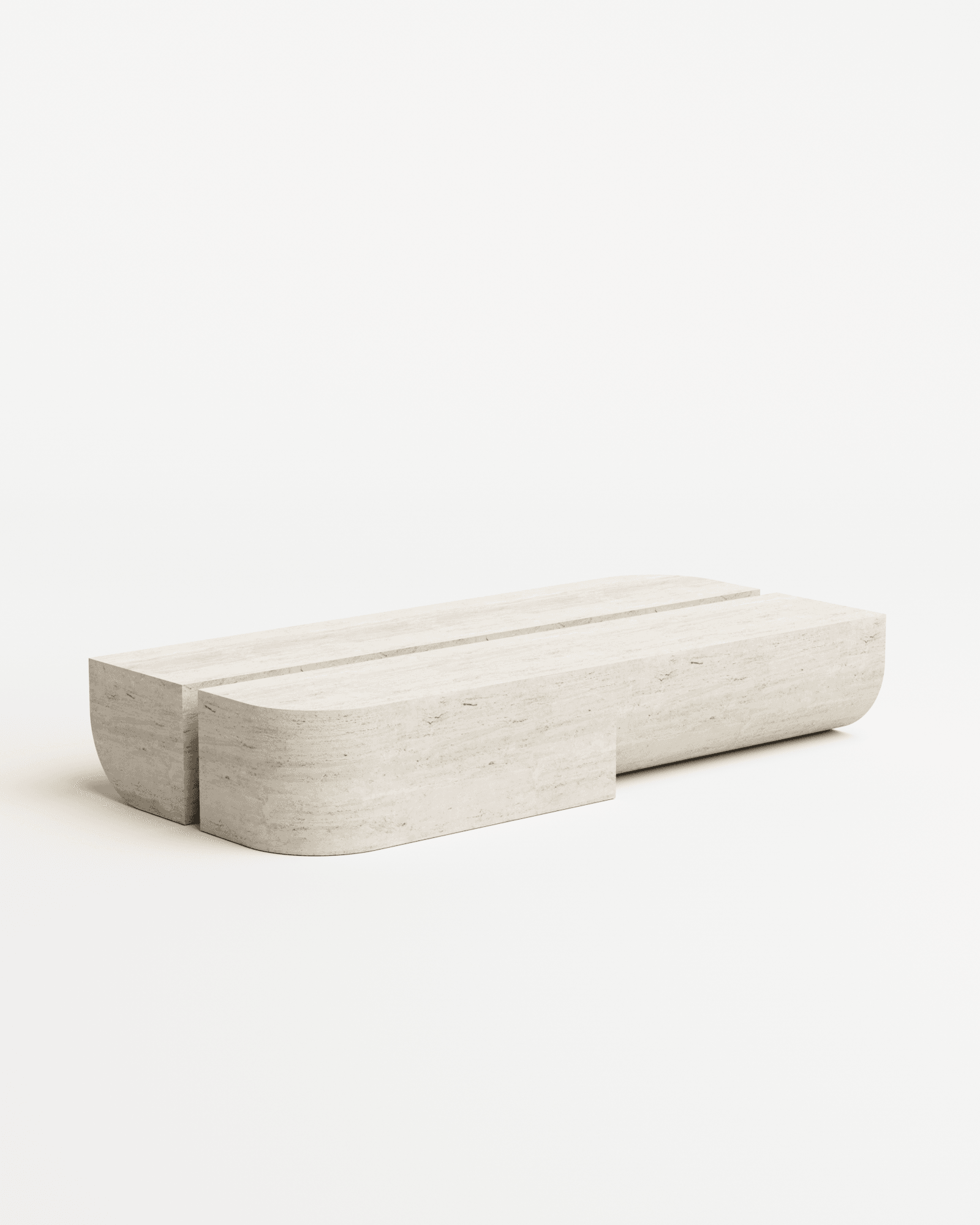 Undum Coffee Table in travertine by HADGE - two low modular travertine stone blocks with natural banding and one rounded end