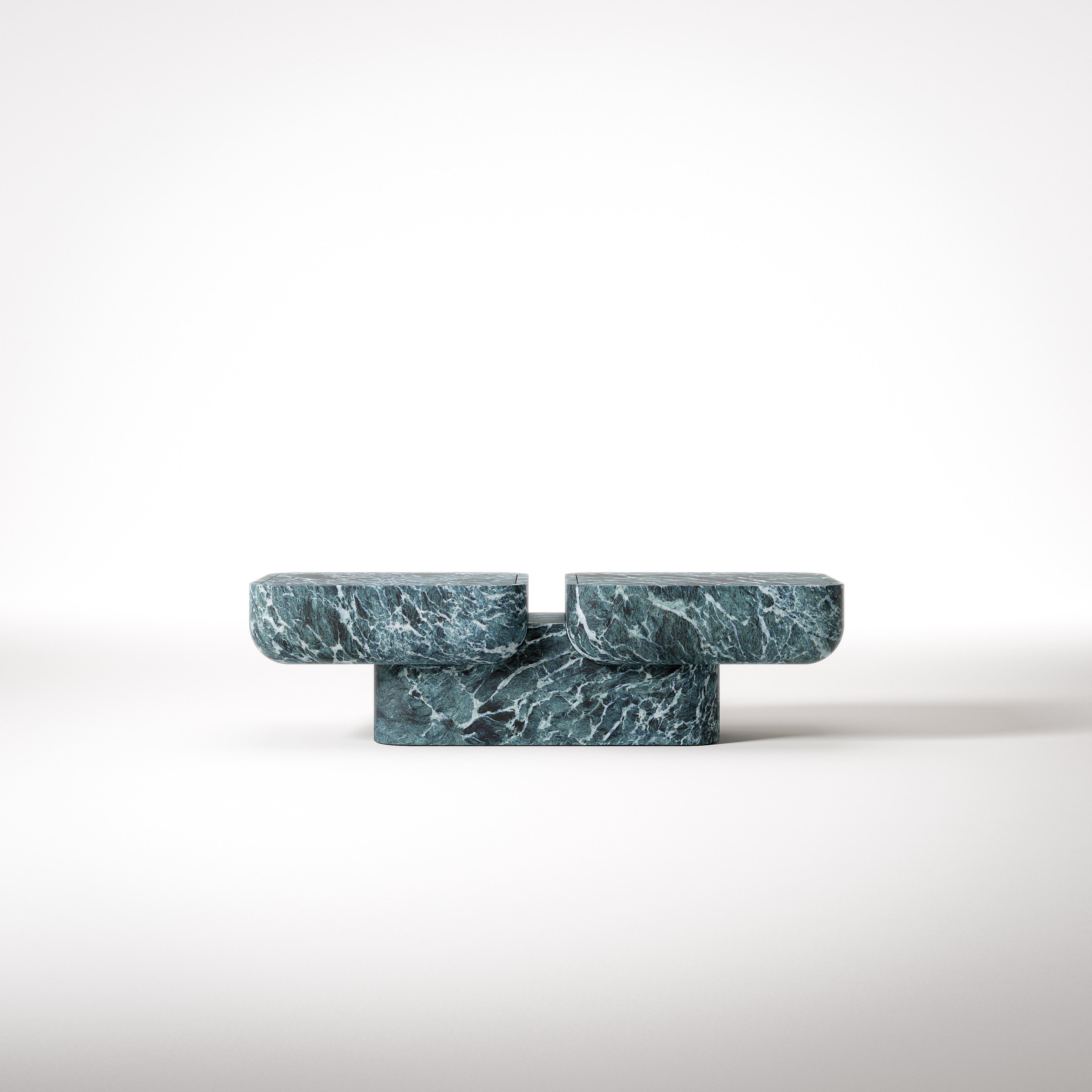Supernova modular table by Giulio Zizzari – three interlocking dark green marble blocks, Urano